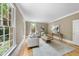 Inviting living room filled with natural light, featuring neutral tones and classic architecture details at 4109 City Of Oaks Wynd, Raleigh, NC 27612