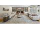Elegant living room with brick fireplace, built-in shelving, and hardwood floors, ideal for gatherings at 4109 City Of Oaks Wynd, Raleigh, NC 27612