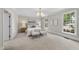 Serene main bedroom offers ample natural light and a calming neutral color palette at 4109 City Of Oaks Wynd, Raleigh, NC 27612