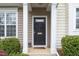 Close up of the front door and entrance of the townhome at 4114 Brenmar Ln, Durham, NC 27713