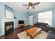 Living room with a dark fireplace, hardwood floors, and a view of the front door at 4114 Brenmar Ln, Durham, NC 27713