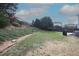 Large backyard with lush grass, a wooden fence, and mature landscaping in a suburban setting at 412 Ashdale Dr, Fuquay Varina, NC 27526