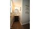 Cozy powder room with vanity and decorative 'soap & water' wall hanging at 412 Ashdale Dr, Fuquay Varina, NC 27526