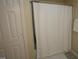 Clean bathroom featuring a shower with a white curtain and a neutral color scheme at 412 Ashdale Dr, Fuquay Varina, NC 27526