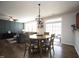 Charming dining area with a round table, stylish light fixture, and backyard access at 412 Ashdale Dr, Fuquay Varina, NC 27526