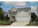 Charming two-story home with a two-car garage, complimented by a well-manicured lawn at 412 Ashdale Dr, Fuquay Varina, NC 27526