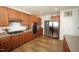 Spacious kitchen with stainless steel appliances, wooden cabinetry, and modern finishes at 412 Ashdale Dr, Fuquay Varina, NC 27526