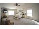 Large main bedroom with vaulted ceiling, ceiling fan, sitting area and lots of natural light at 412 Ashdale Dr, Fuquay Varina, NC 27526