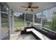 Inviting screened-in porch with a ceiling fan and comfortable seating overlooking the backyard at 412 Ashdale Dr, Fuquay Varina, NC 27526