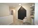 Cozy upstairs landing area with a unique chalkboard wall and soft carpeting at 412 Ashdale Dr, Fuquay Varina, NC 27526