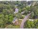 Aerial view of a neighborhood with lush greenery, a lake and well-maintained homes at 4504 Ryegate Dr, Raleigh, NC 27604