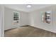 Bright bedroom features hardwood floors and two windows at 4504 Ryegate Dr, Raleigh, NC 27604