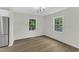 The dining area is well-lit by two windows, showing off the wood-look flooring at 4504 Ryegate Dr, Raleigh, NC 27604