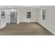 Bright dining area featuring wood-look floors and natural light from two windows at 4504 Ryegate Dr, Raleigh, NC 27604