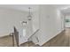 Welcoming entryway featuring wood-look floors, a staircase, and a stylish light fixture at 4504 Ryegate Dr, Raleigh, NC 27604