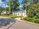 Charming two-story home on a well-maintained lawn with mature trees and a mailbox at 4504 Ryegate Dr, Raleigh, NC 27604