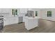 This kitchen features an island, stainless steel appliances, and an eat-in dining space at 4504 Ryegate Dr, Raleigh, NC 27604