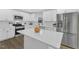 Kitchen featuring white cabinets, stainless steel appliances, and center island at 4504 Ryegate Dr, Raleigh, NC 27604