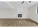 Open living room with hardwood floors, fireplace, and lots of natural light at 4504 Ryegate Dr, Raleigh, NC 27604