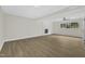 Bright living room with hardwood floors, a ceiling fan, and a decorative fireplace at 4504 Ryegate Dr, Raleigh, NC 27604