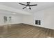 Bright and open living room featuring fireplace and door to outdoor deck at 4504 Ryegate Dr, Raleigh, NC 27604