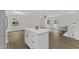 Open living space featuring the staircase, kitchen island, natural light, and modern lighting at 4504 Ryegate Dr, Raleigh, NC 27604
