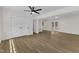 Living room with hardwood floors, large closet, and doors leading to deck at 4504 Ryegate Dr, Raleigh, NC 27604