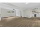 Bright open living room with wood floors, ceiling fan, closet and beverage bar at 4504 Ryegate Dr, Raleigh, NC 27604