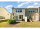 Backyard view of the home exterior with lawn, siding, and backyard patio at 5031 Eagle Stone Ln, Raleigh, NC 27610