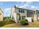 Exterior view of home showcasing the backyard with a lawn and vinyl siding at 5031 Eagle Stone Ln, Raleigh, NC 27610