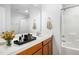 Well-lit bathroom featuring a vanity with a mirror, complemented by a tub-shower combo at 5031 Eagle Stone Ln, Raleigh, NC 27610