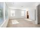 A light-filled bedroom boasts plush carpeting, large windows, and access to an attached bathroom at 5031 Eagle Stone Ln, Raleigh, NC 27610