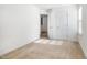 Carpeted bedroom with white walls and natural light with a view into the hallway at 5031 Eagle Stone Ln, Raleigh, NC 27610
