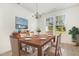 Staged dining room with a table set for six and a window at 5031 Eagle Stone Ln, Raleigh, NC 27610