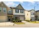 Attractive two-story townhouse with well-kept landscaping and attached single-car garage at 5031 Eagle Stone Ln, Raleigh, NC 27610
