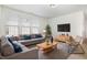 Comfortable living room with plush sofa, natural light, and stylish decor at 5031 Eagle Stone Ln, Raleigh, NC 27610
