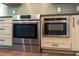 Modern stainless steel oven and microwave appliances installed in the kitchen at 515 N Churton St # Ste 201, Hillsborough, NC 27278