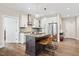Contemporary kitchen featuring stainless steel appliances, an island with seating, and modern lighting at 515 N Churton St # Ste 201, Hillsborough, NC 27278