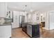 Well-equipped kitchen with stainless steel appliances, sleek countertops, and a functional center island at 515 N Churton St # Ste 201, Hillsborough, NC 27278