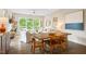Sunlit living and dining area with modern decor, hardwood floors, and large windows offering a serene view at 515 N Churton St # Ste 201, Hillsborough, NC 27278
