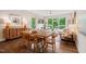 Bright living room and dining area with hardwood floors, large windows, and modern furnishings at 515 N Churton St # Ste 201, Hillsborough, NC 27278
