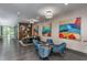Modern lobby with ample seating, wood accent wall with fireplace, and colorful artwork at 515 N Churton St # Ste 201, Hillsborough, NC 27278