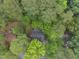 Aerial image showcases the home nestled among lush trees and landscaping at 5315 Fortunes Ridge Dr, Durham, NC 27713