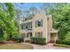 Charming two-story home with blue shutters surrounded by lush greenery and a well-maintained yard at 5315 Fortunes Ridge Dr, Durham, NC 27713