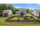 Spacious backyard featuring well-maintained lawn and an outdoor living area with hot tub at 55 Prospectus Ln, Franklinton, NC 27525