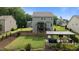 Spacious backyard featuring well-maintained lawn and an outdoor living area with hot tub at 55 Prospectus Ln, Franklinton, NC 27525