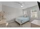 Bedroom featuring a single bed with a blue comforter, a desk, and two windows at 55 Prospectus Ln, Franklinton, NC 27525