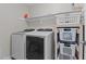 Functional laundry room with modern washer and dryer, plus storage for supplies at 55 Prospectus Ln, Franklinton, NC 27525