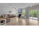Open living space with a cozy fireplace, a large sectional sofa, and easy access to a screened-in porch at 55 Prospectus Ln, Franklinton, NC 27525
