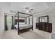 Spacious main bedroom features a tray ceiling, dark wood furniture, and neutral decor at 55 Prospectus Ln, Franklinton, NC 27525